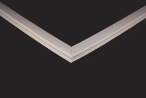 A close-up of the Dalmec PPCC 700 T2 RU Door Seal shows its smooth, decorative profile with subtle ridges, forming a precise joint at a sharp corner against a black background.