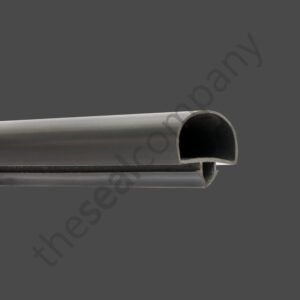 A close-up of the H&K International T03183 / 812424 Drawer Gasket Seal in black rubber with a rounded top and grooved base, shown on a dark grey background. The faint “thesealcompany” watermark appears diagonally across the image.
